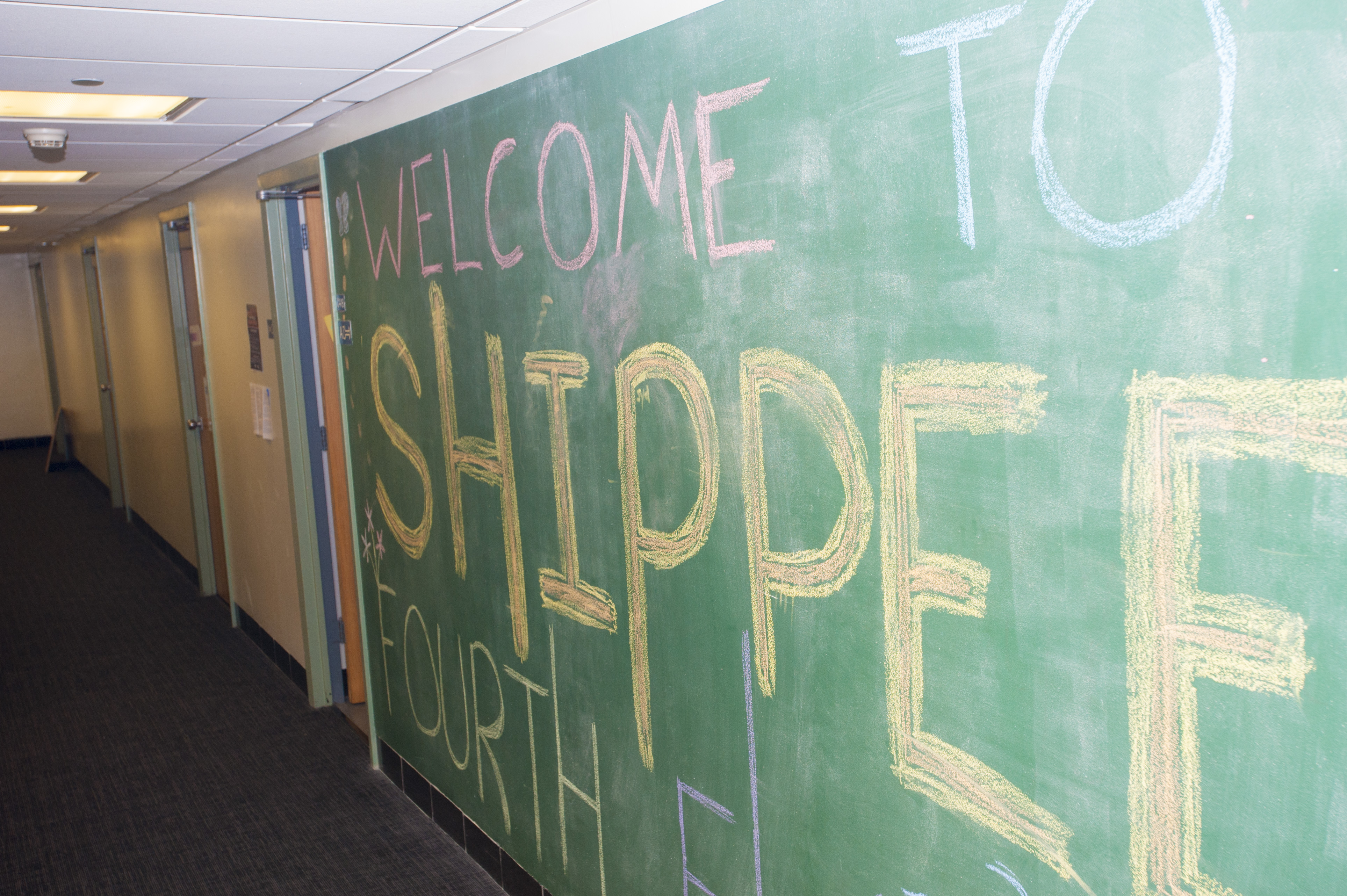 A large chalk board welcoming students to the Shippee residence hall