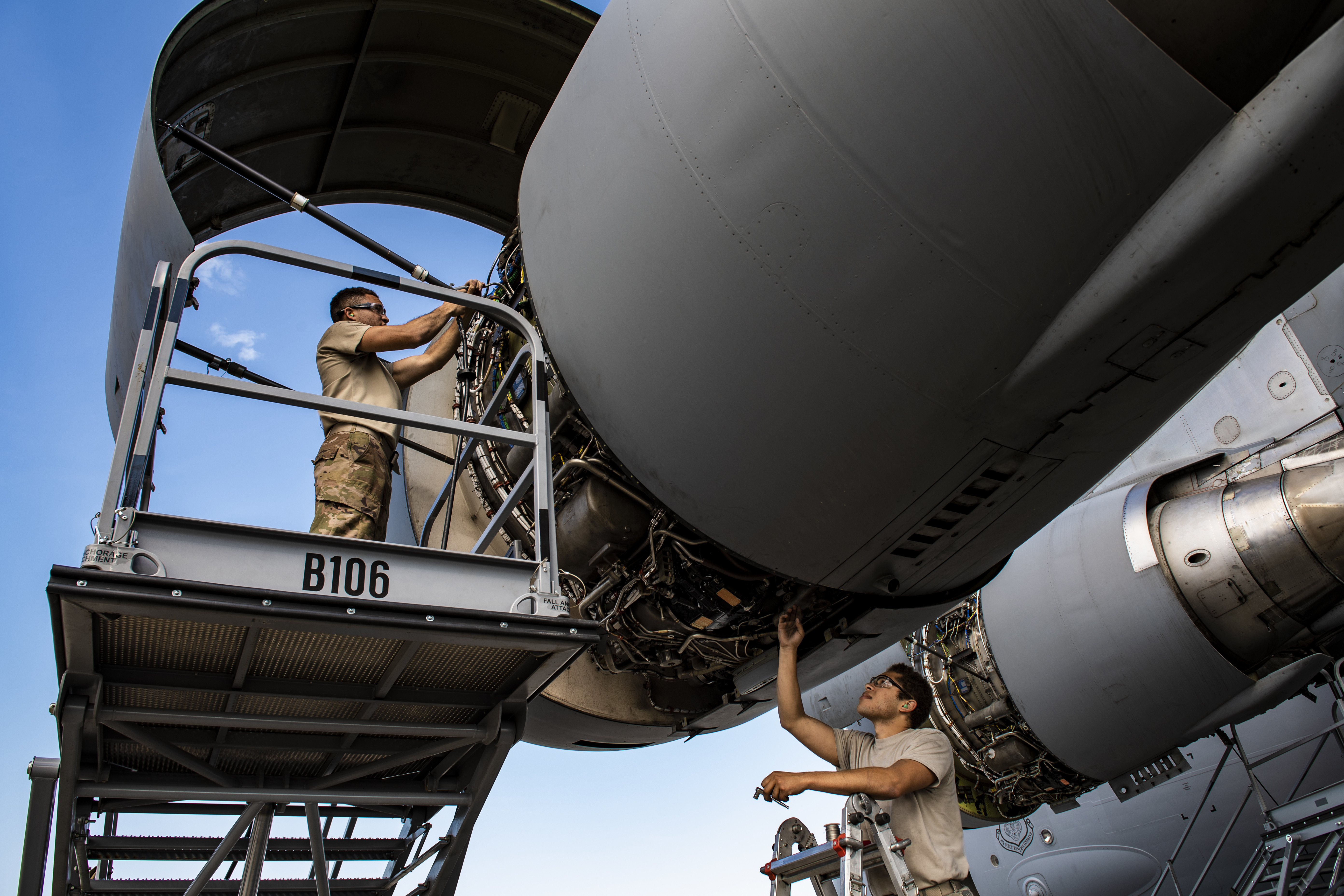 Technicians perform maintenance on a C-17 Globemaster III engine during a home station check inspection.