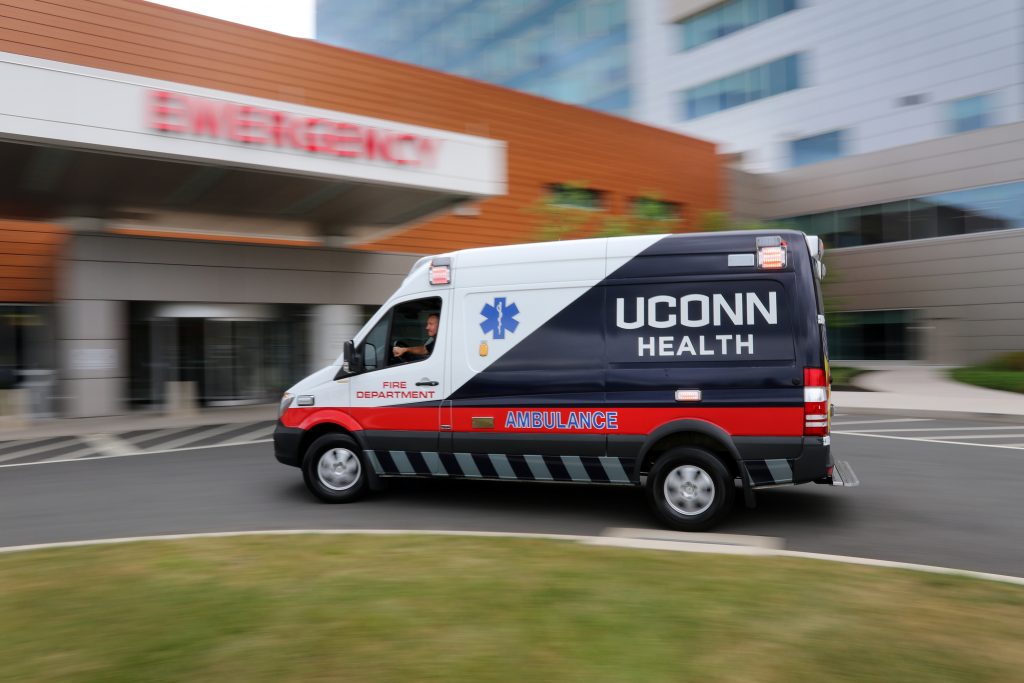 An ambulance pulls up to the emergency entrance at UConn Health