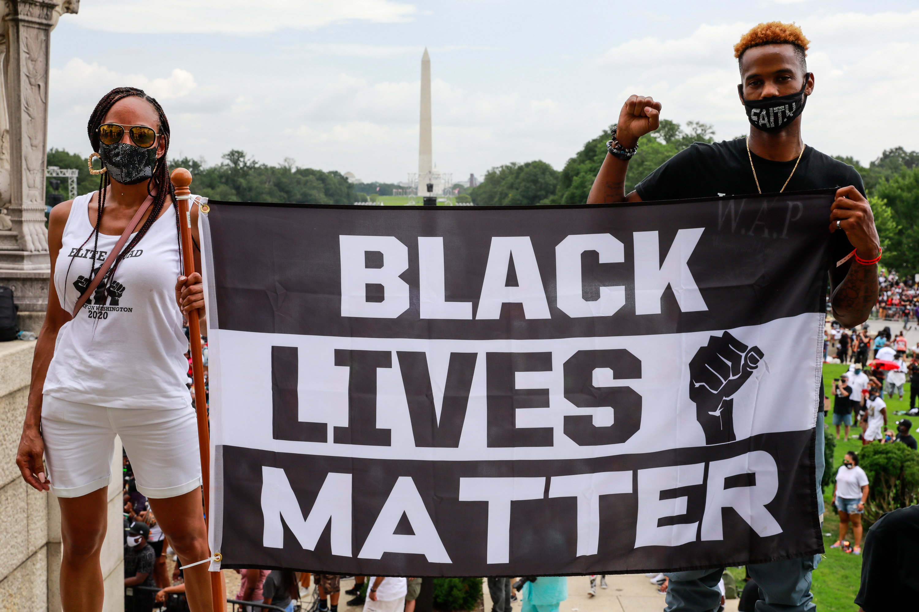 Protesters hold a sign in support of Black Lives Matter during the Commitment March on August 28, 2020 in Washington, DC.