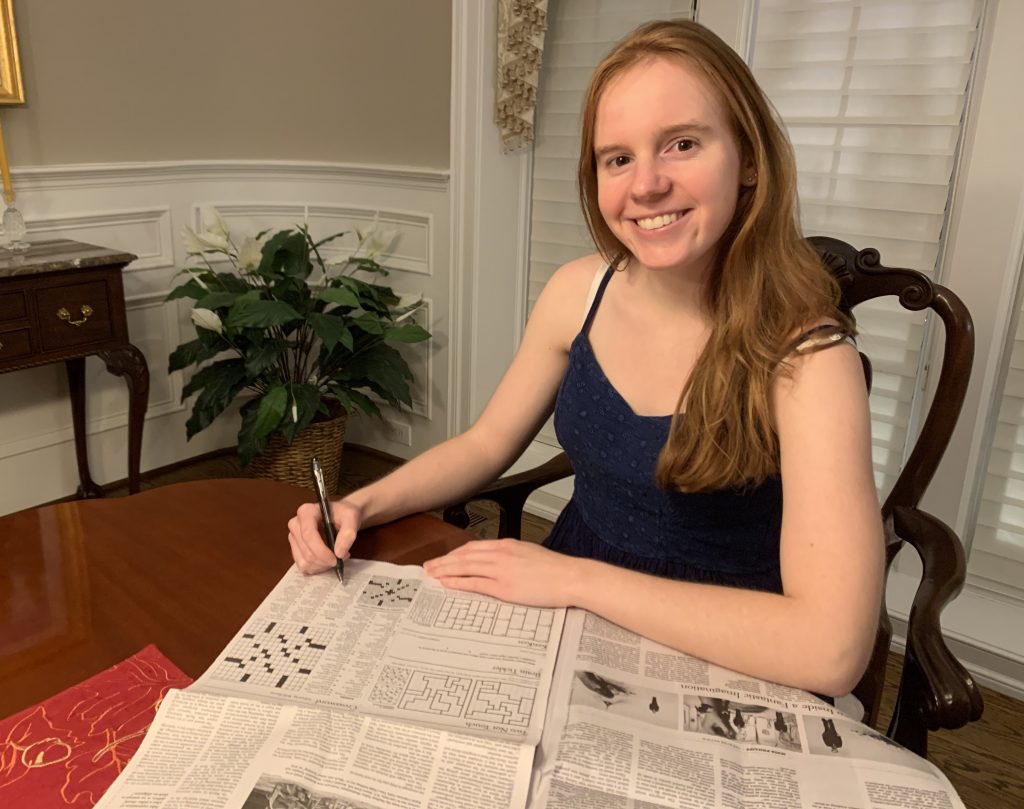 a woman doing a crossword puzzle