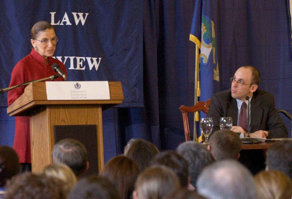 Justice Ruth Bader Ginsburg speaks in the Reading Room in William F. Starr Hall at the UConn School of Law in Hartford on March 12, 2004. At right is her former clerk, Paul Schiff Berman, who was then on the law school faculty and who moderated a question-and-answer session.