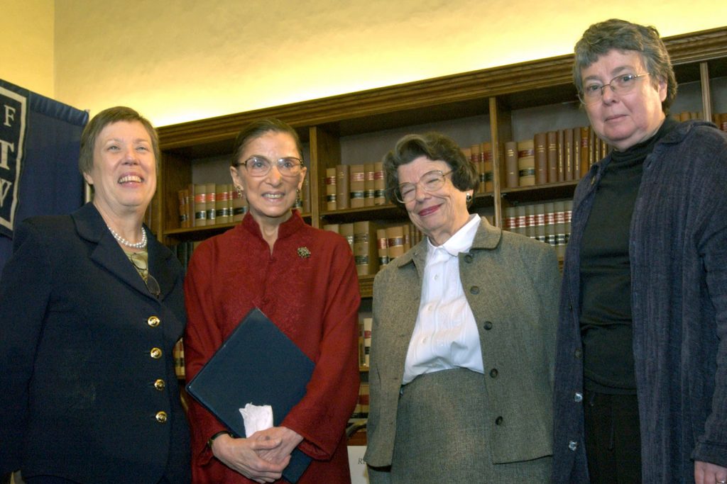 Supreme Court Justice Ruth Bader Ginsburg spoke during her 2004 visit to the UConn School of Law about the challenges women faced in their law careers. From left: Nell Jessup Newton, then dean of the law school; Ginsburg; Ellen Ash Peters, the first female chief justice of the Connecticut Supreme Court; and UConn Law Professor Carol Weisbrod. (UConn School of Law Archives)