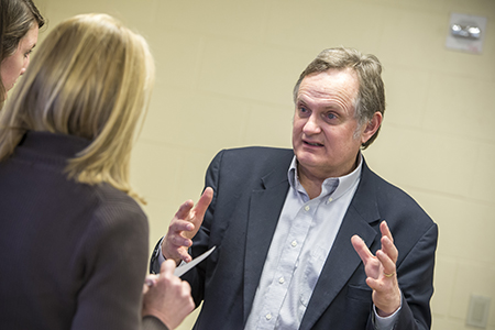 UConn faculty member Del Siegle speaks with doctoral students.