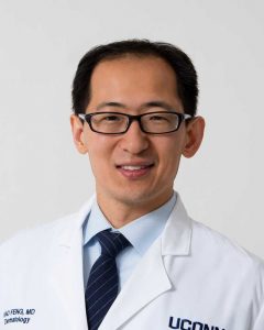Dr. Feng white coat portrait