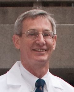 Dr. Carl Malchoff in white coat from group portrait