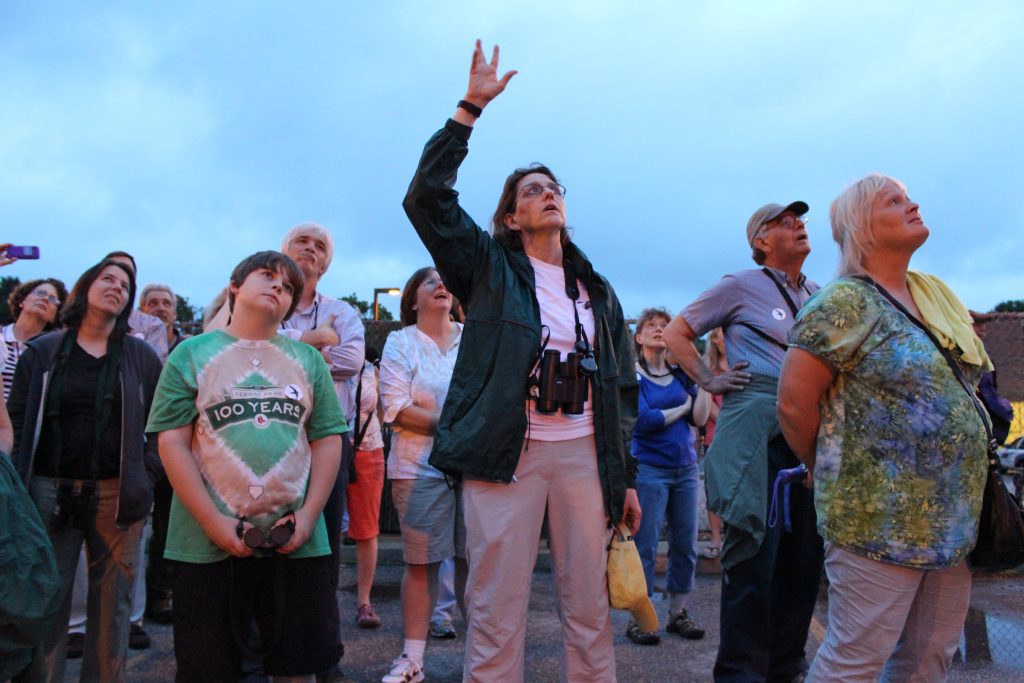 UConn Professor Margaret Rubega leads a group of members of the public on a bird-watching trip around campus