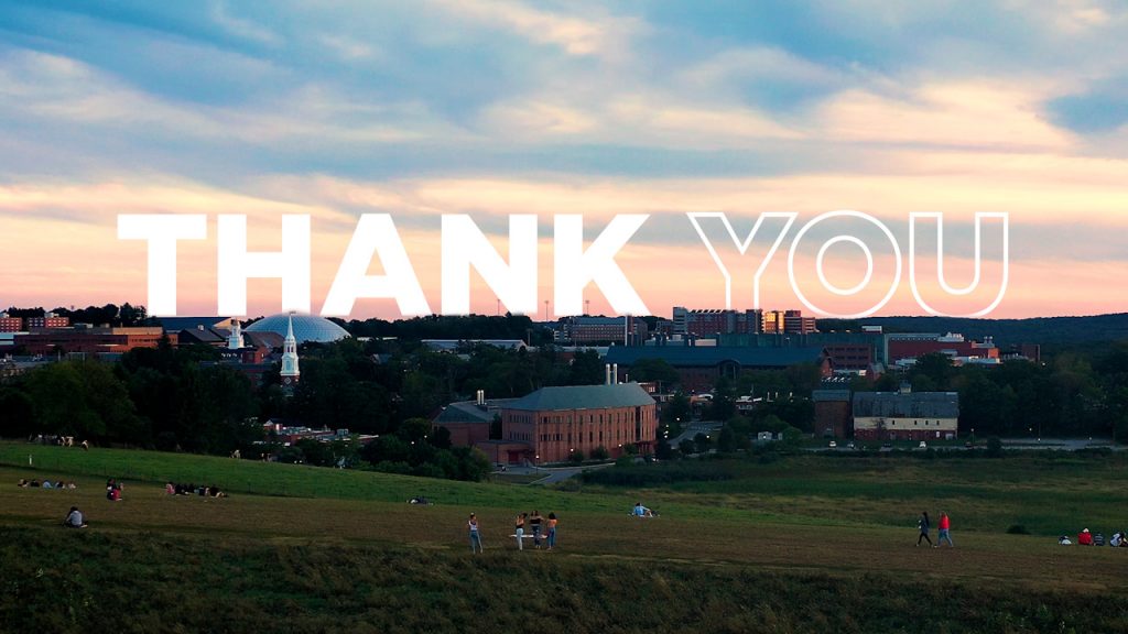 The word thank you sprawled out across horsebarn hill at sunset