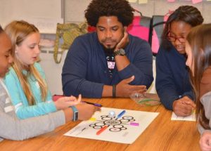 Dwight Sharpe works with middle school students.