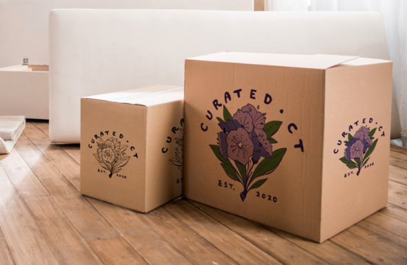 Two boxes ready to ship, featuring the Curated CT logo