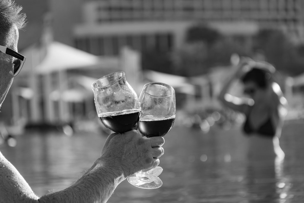 White man holding two beers