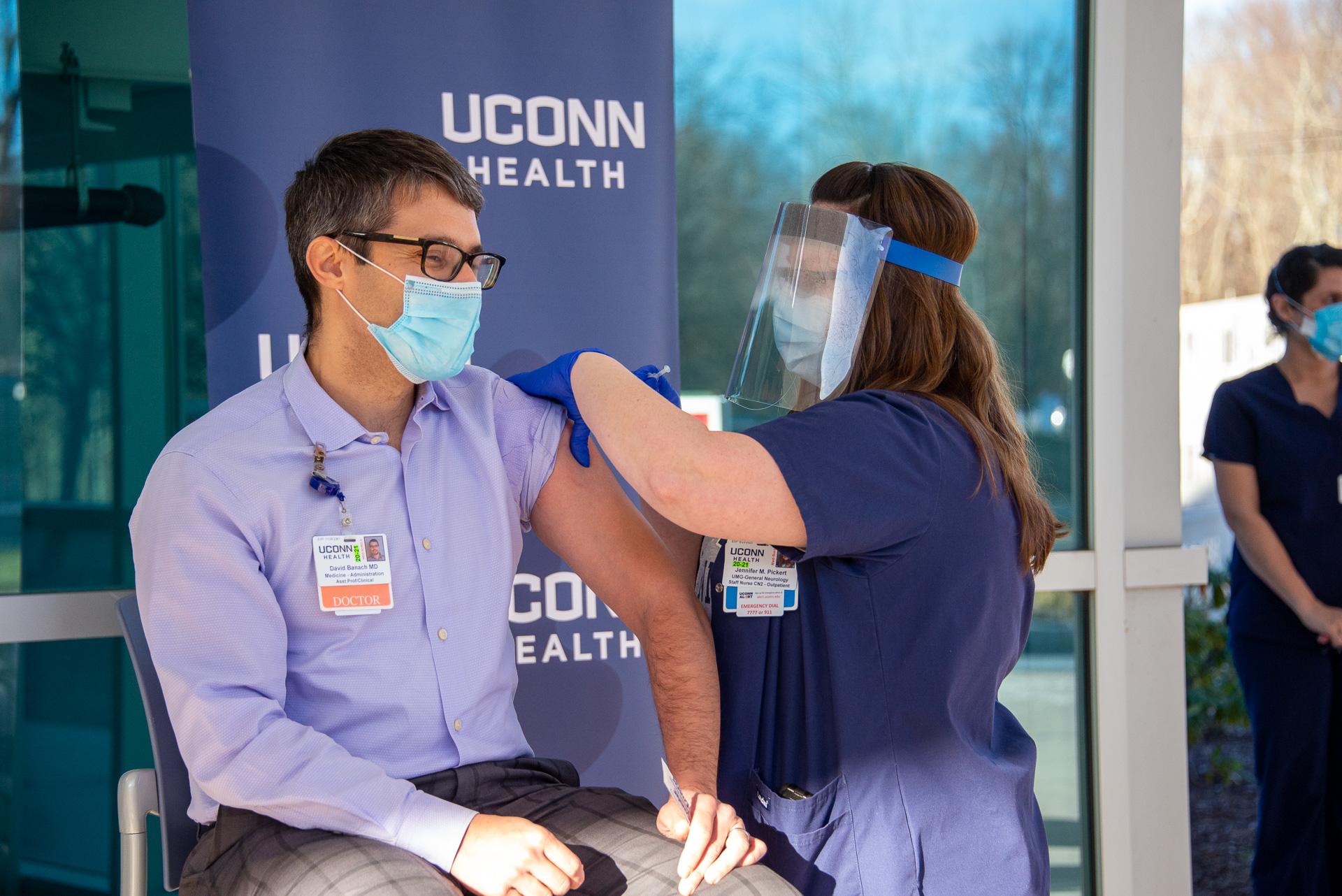 Dr. David Banach gets vaccinated for COVID-19 by staff nurse Jennifer Pickert on December 15, 2020.