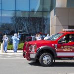 As the pandemic stretched on into summer, the renewed sense of gratitude so many felt toward health care workers led to parades held by UConn's Division of Public Safety in Farmington, here, and in Storrs Center, thanking medical providers for their near-superhuman resilience. (Tina Encarnacion/UConn Health photo)
