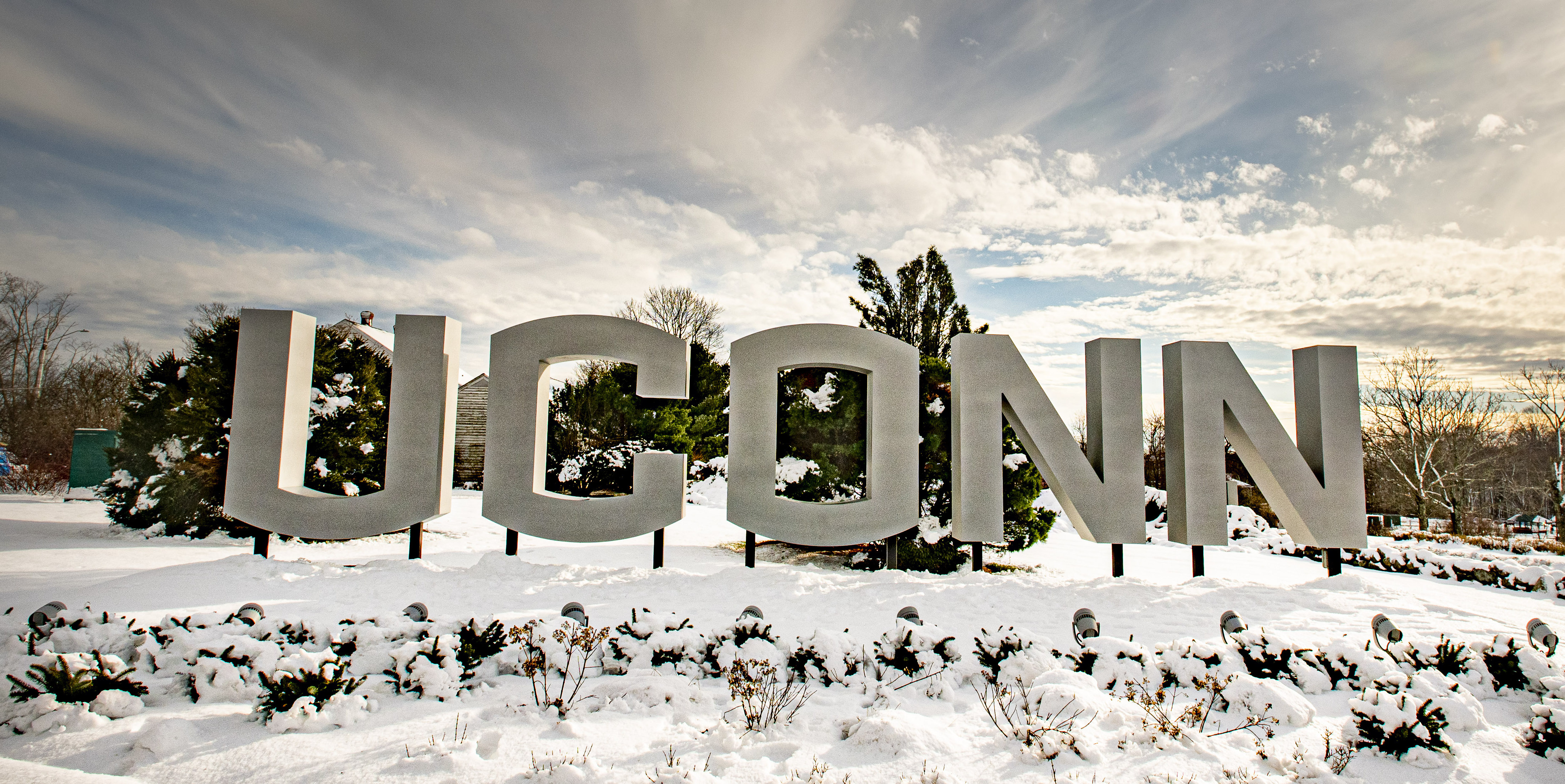 Gateway UConn sign surrounded by snow