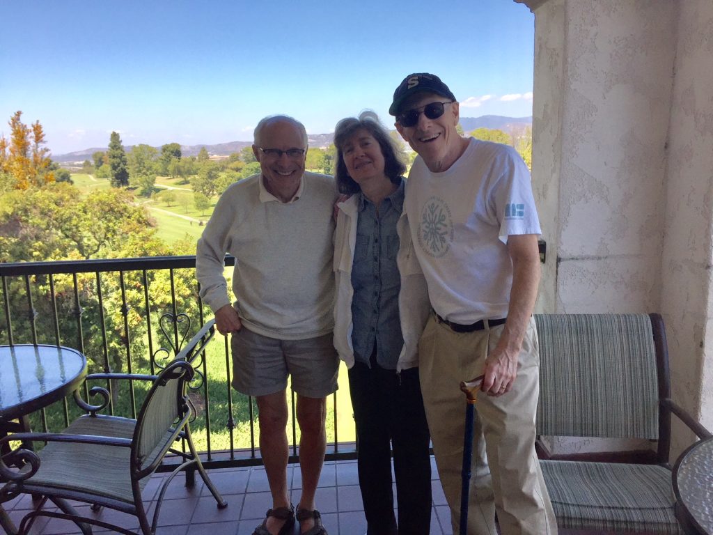 UConn Law Professor Lewis Kurlantzick, left, with Deborah Silberstein and Fred Cantor, both 1978 graduates of the law school, in California in 2018. Cantor's new book describes the lifelong New York Knicks obsession that he shares with Kurlantzick.
