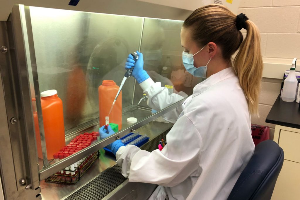 Kimberly Hayes with pipette in clinical lab