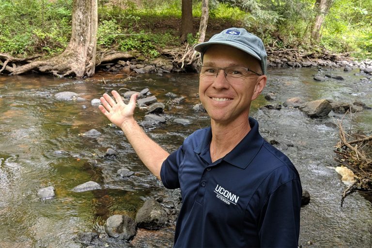 Mike Dietz stands near a stream