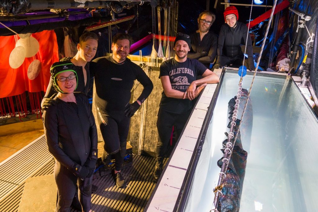 Puppeteer Basil Twist, center leaning on tank, with his crew for “Symphonie Fantasique.” 