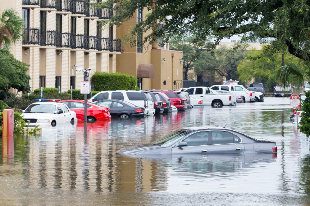Cars submerged in Houston, Texas in the aftermath of Hurricane Harvey in 2017. A number of factors, including race, influence how different cities respond to flooding, according to new research.