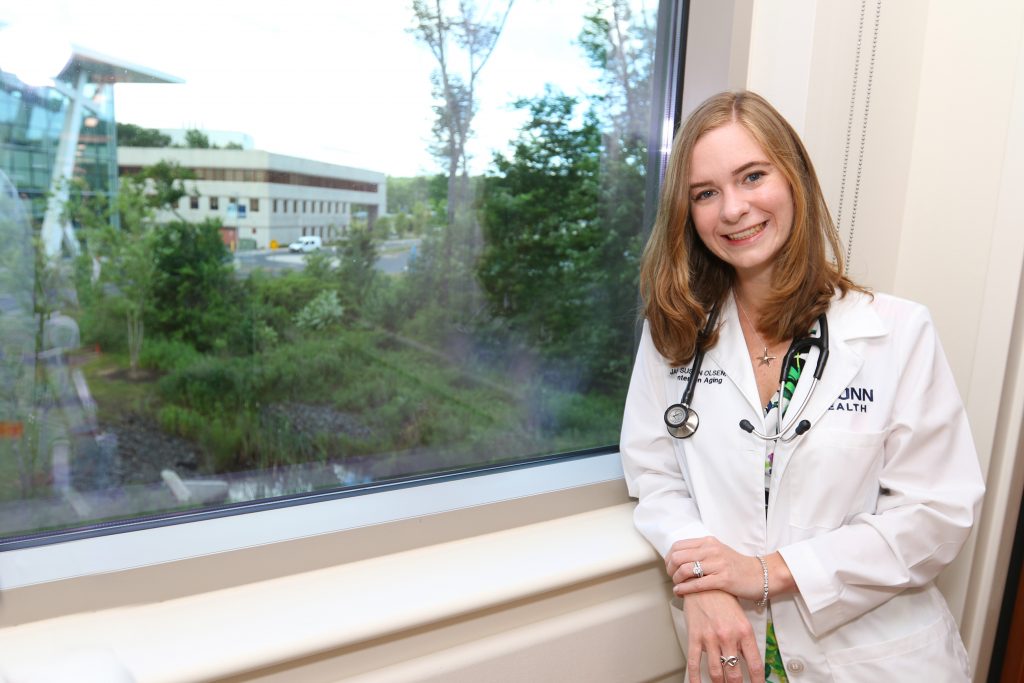 Dr. Jaclyn Olsen Jaeger portrait in front of window