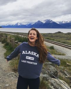 Alumna and documentary filmmaker Michelle Wax pictured outdoors in Alaska during the making of her documentary film about the nature of happiness.