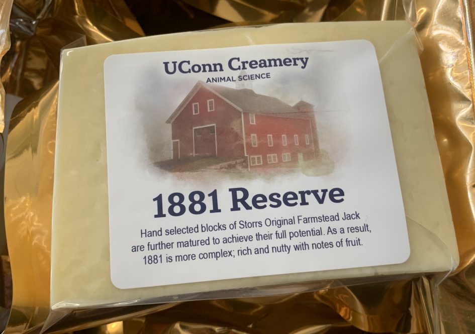 Close up of UConn Creamery's 1881 Reserve in gold packaging with image of Red Barn on label