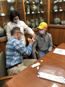 Jill Fitzgerald supervises two adult learners in proper immunization technique
