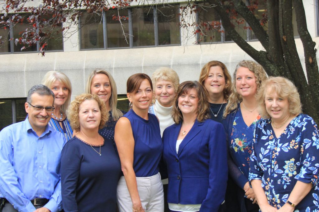 Outdoor portrait of members of the UConn John Dempsey Hospital Quality Department