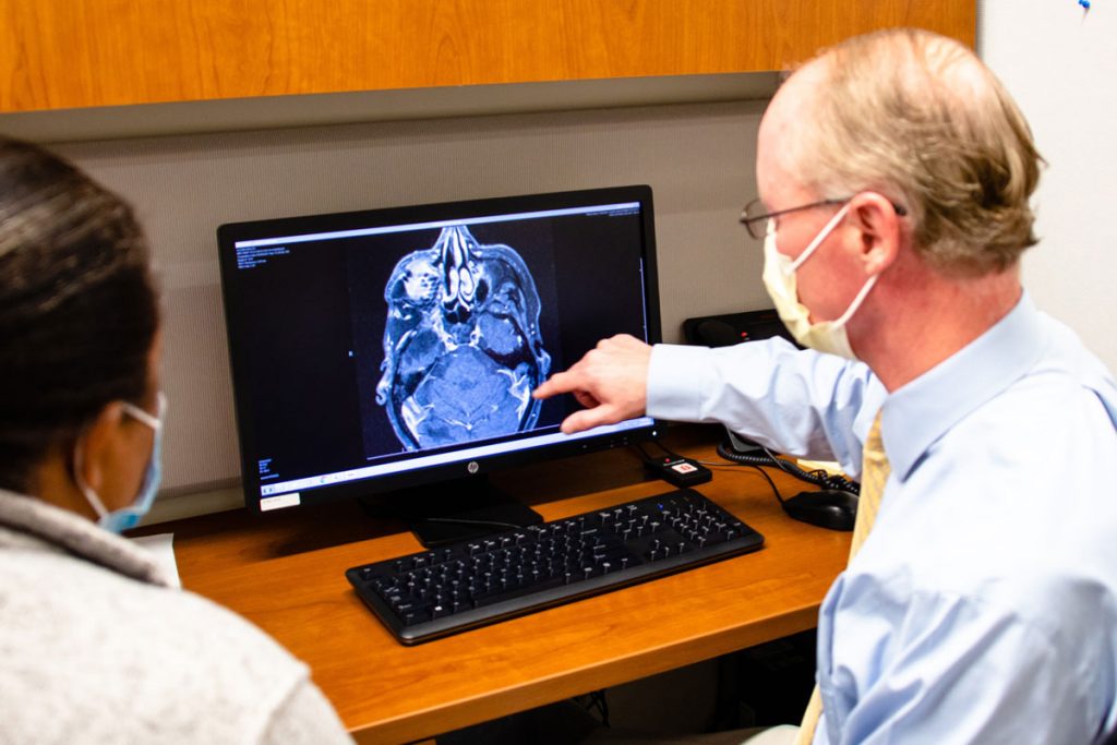 Dr. Keving Becker showing patient a brain image