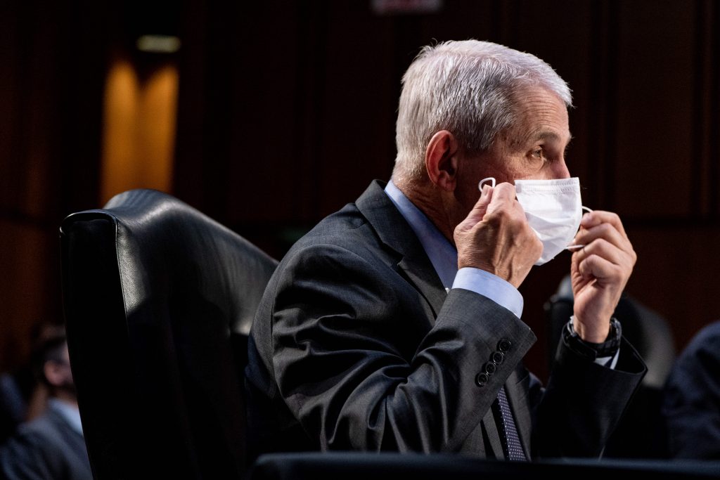 WASHINGTON, DC - MARCH 18: Dr. Anthony Fauci, Director at the National Institute Of Allergy and Infectious Diseases, takes off his face mask during a hearing, with the Senate Committee on Health, Education, Labor, and Pensions, on the Covid-19 response, on Capitol Hill on March 18, 2021 in Washington, DC. The COVID-19 pandemic has underscored the need for scientists to be better communicators.