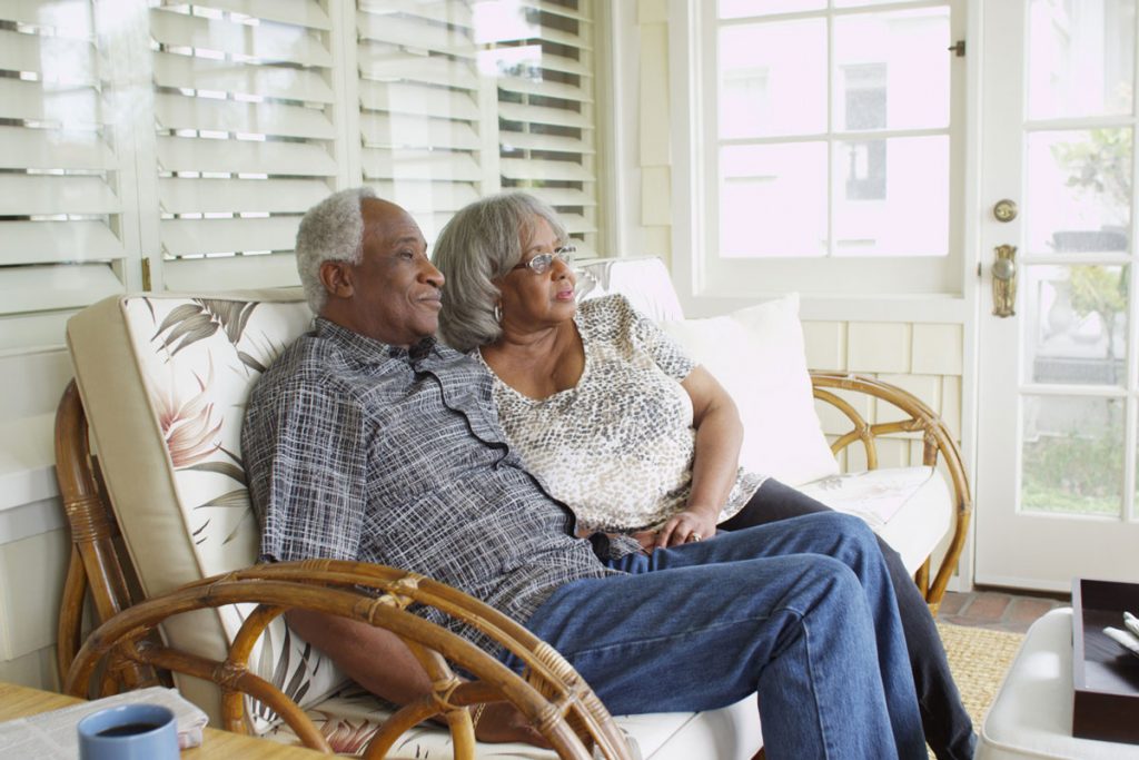 Older couple sharing porch bench