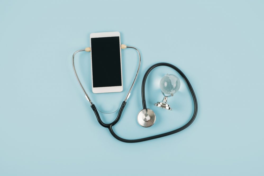 A doctor's stethoscope connected to a mobile phone. Students made phone calls to hundreds of COVID-19 patients, along with seniors isolated by the pandemic.