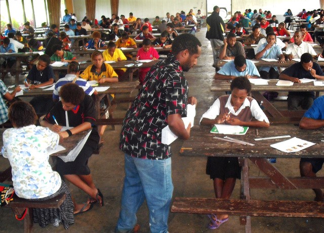 Secondary school students in PNG being tested on their language skills.