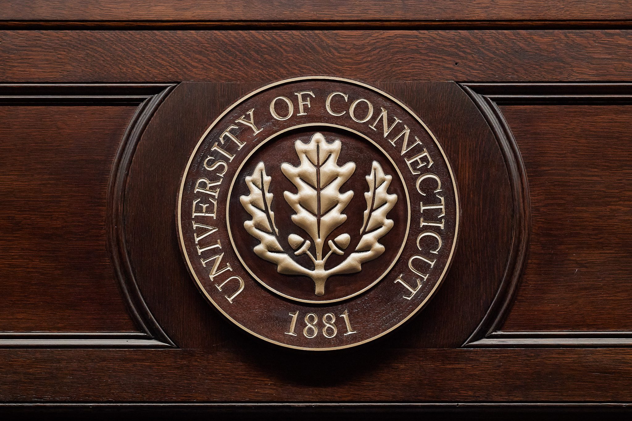 The oak leaf seal of the University of Connecticut.