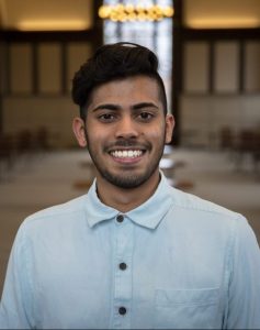 Mukund Desibhatla, a physiology and neurobiology and Spanish double major with a European studies minor, stands in Wilbur Cross hall for a portrait.