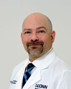 Dr. Eric Mortensen portrait, white coat