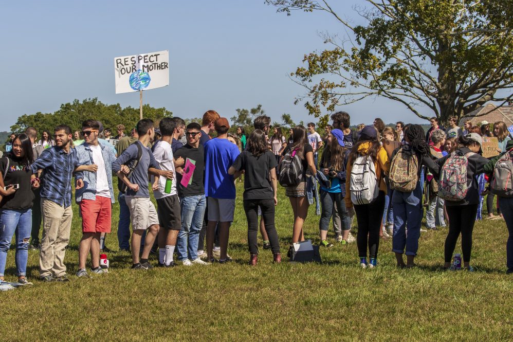 Students gather on the Great Lawn to form an hour glass during the Climate Strike on Sept. 20, 2019. The Connecticut Institute for Resilience and Climate Adaptation is hosting a series of webinars this summer to examine climate change and policy from a multitude of angles.