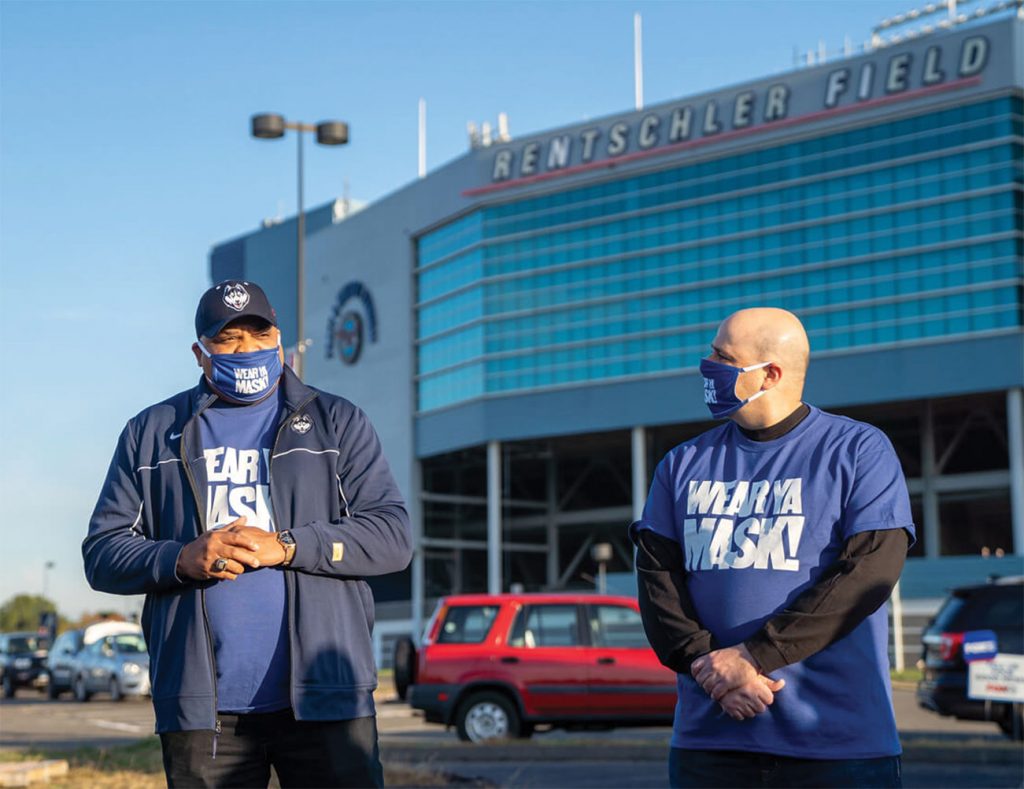 Smith and Jakubowski standing in front of Pratt & Whitney Stadium at Rentschler Field