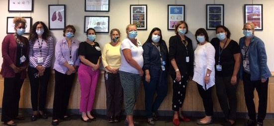 Group shot of UConn Health clinical social workers, in masks