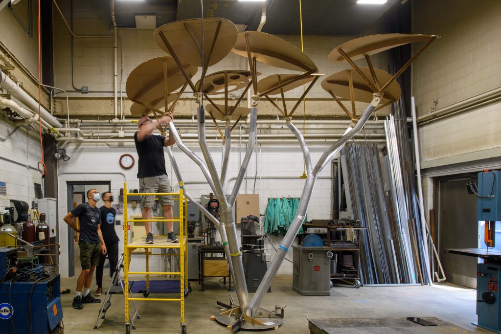 solar tree under construction in a shop