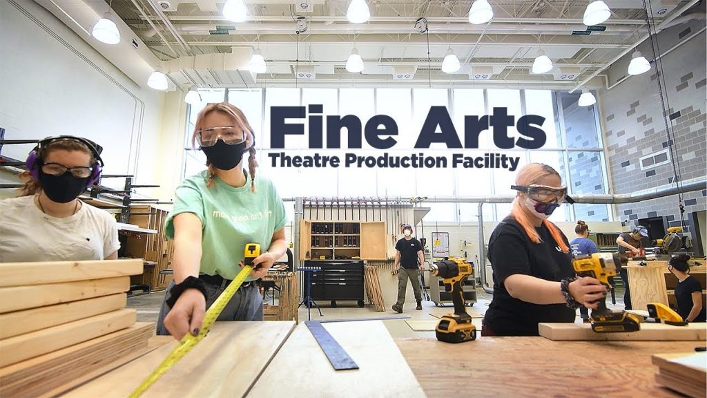 students working on building theatre sets in new production facility