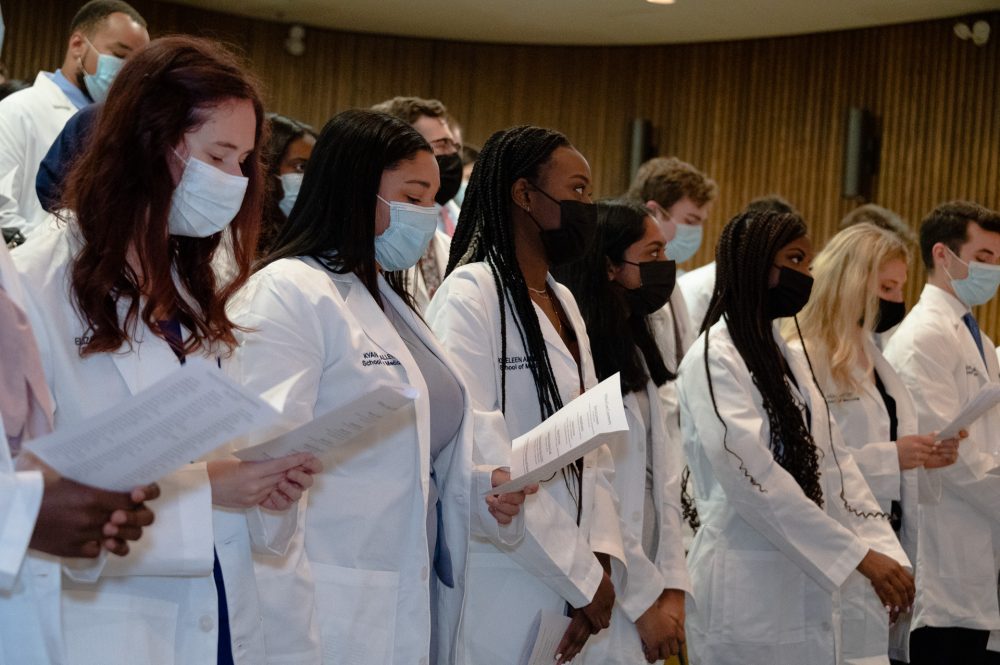 UConn School of Medicine and UConn School of Dental Medicine students receiving their white coats in a ceremony on Aug. 20.