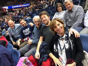 Michael (far left) and Shari Cantor (far right) and family members taking in a UConn basketball game. The Cantors have made a major donation to support UConn students.
