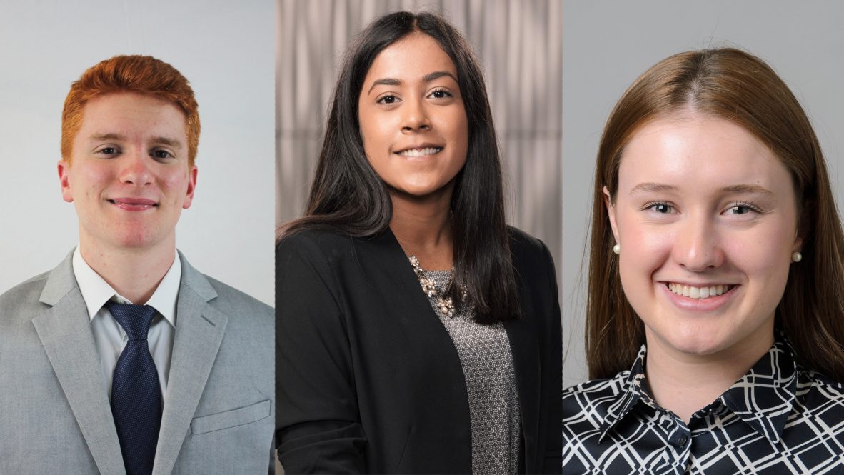 Three students selected as Actuaries of Tomorrow pose for their portraits.