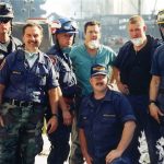 group portrait at former World Trade Center site in New York City within hours of the 9/11 attacks