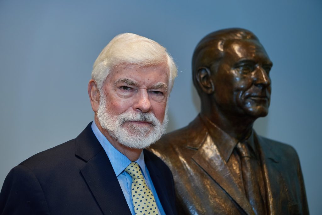 Former Senator Chris Dodd, with the bust of his father at the Thomas J. Dodd Research Center on Sept. 24, 2021.