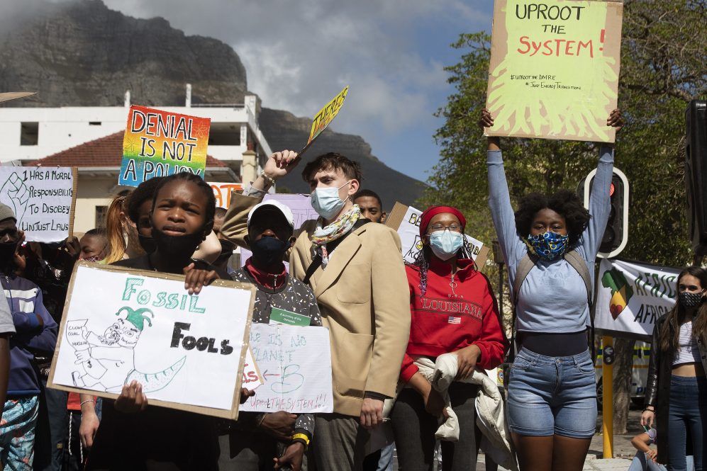 Hundreds of people take part in a Global Climate Strike protest on September 24, 2021, in Cape Town, South Africa, demonstrating against the causes of global climate change, and in particular, the South African Department of Mineral Resources and Energy (DMRE).