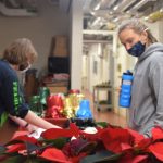 Students participating in the annual poinsettia sale run by the UConn Horticulture Club. (Christie Wang/UConn Photo)