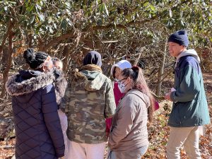 Michio Agresta ’22 (right) (CAHNR) leading a tree identification exercise at an Urban Forestry Workshop. Agresta is also working with a student in East Hampton, on building a trailhead kiosk on a section of trails near his house. (Photo courtesy of Laura Cisneros).