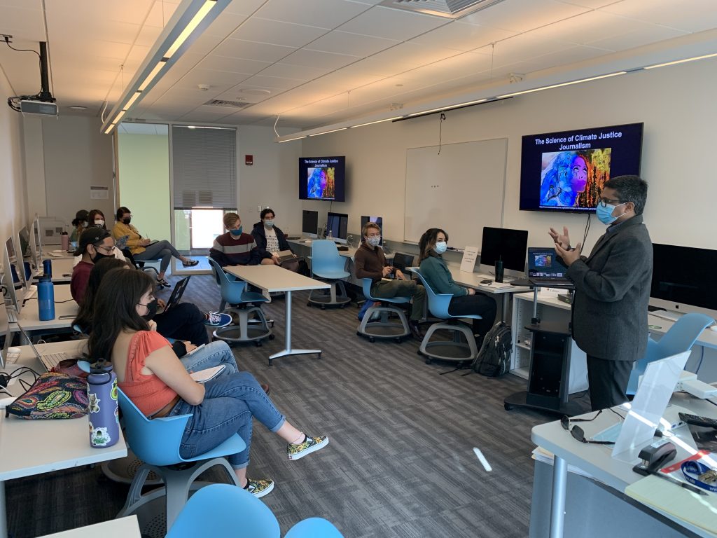 Prakash Kashwan giving a lecture to UConn journalism students on the science of climate justice. (Photo by Scott Wallace